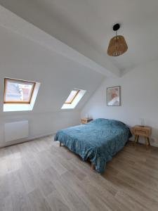 Ένα ή περισσότερα κρεβάτια σε δωμάτιο στο Chez Vincent - Centre Historique de Colmar avec parking inclus