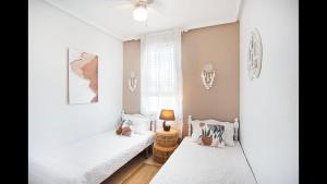 Un pat sau paturi într-o cameră la Apartamento Buenavista +9 fotografii
