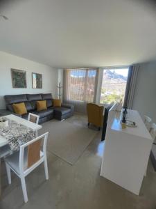 a living room with a couch and a table at Ventana del Nublo 1D in Tejeda