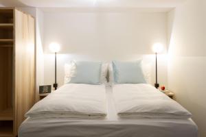 Postel nebo postele na pokoji v ubytování Hotel Schlüssel