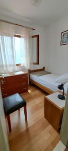 Postel nebo postele na pokoji v ubytování Apartment Lucija