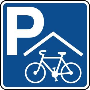 un cartello con una bicicletta parcheggiata davanti a una casa di Appart 5p terrasse sud vue mer, accès direct plage a Frontignan