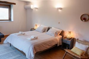 Postel nebo postele na pokoji v ubytování CASAS DA MORGADINHA - Casas de Férias e Turismo Rural
