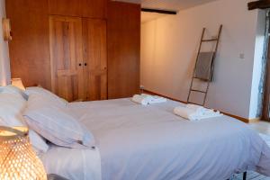 Postel nebo postele na pokoji v ubytování CASAS DA MORGADINHA - Casas de Férias e Turismo Rural