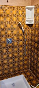 a bathroom with a sink and a tile floor at Vue Mer Capitou in Mandelieu-la-Napoule