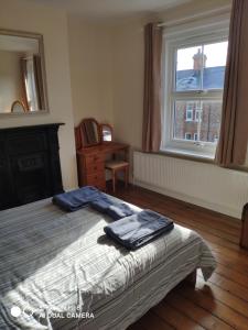 a bedroom with a bed and a window at Number 9 in Hunstanton