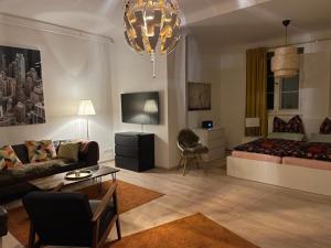 Χώρος καθιστικού στο Großzügige Souterrainwohnung in historischer Stadtvilla im Herzen Zellerfelds +18 φωτογραφίες