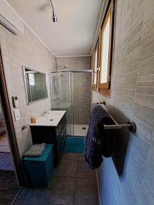 a bathroom with a shower and a sink and a shower at La Bouletière in Dourbies +33 photos