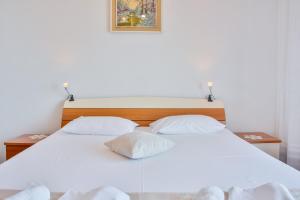 Postel nebo postele na pokoji v ubytování APARTMENT LUCA