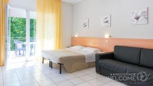 A bed or beds in a room at Welcome Residence per famiglie Még 37 kép