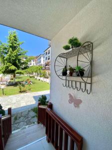 a butterfly decoration on a wall with a butterfly on it at Apartment Blue Lagoon in Rogachevo