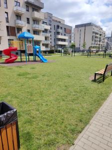 a park with a playground with a slide at Milan Luxury Apartaments III-Maurer Residence in Târgu-Mureş