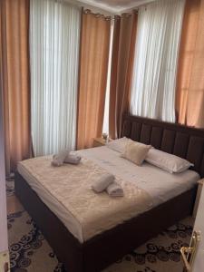 Ένα ή περισσότερα κρεβάτια σε δωμάτιο στο KU&NA HOTEL BELSH