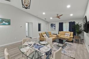 a living room with a table and chairs at Everglade Kiss 3b 2b BBQ, hot tub in Port Charlotte