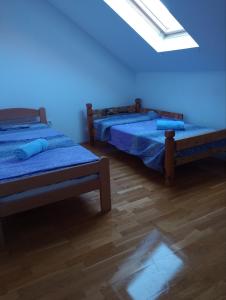 Letto o letti in una camera di Milenijum
