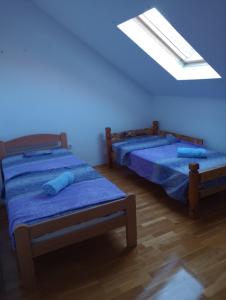 Letto o letti in una camera di Milenijum