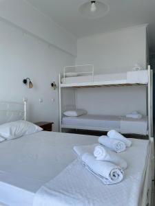 A bed or beds in a room at APOLLON PALACE