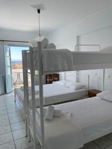 A bed or beds in a room at APOLLON PALACE