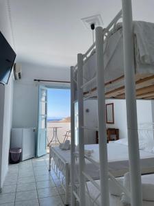 A bed or beds in a room at APOLLON PALACE