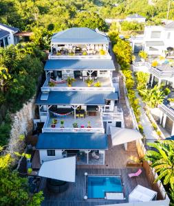 an aerial view of a house with a swimming pool at Villa Les Terrasses de Fonds Thezan in Sainte-Anne