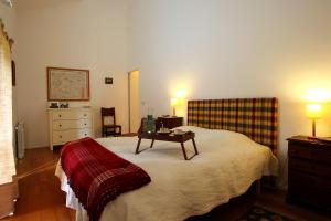 Ένα ή περισσότερα κρεβάτια σε δωμάτιο στο Quinta de Pindela - Natureza e Tradicao