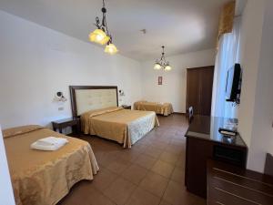 Posteľ alebo postele v izbe v ubytovaní Hotel Soleado