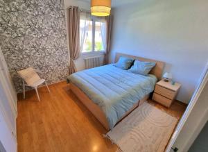 Un ou plusieurs lits dans un hébergement de l'établissement Appartement Cosy entre Lac et Montagne