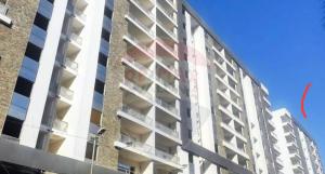 a tall building with a red mark on the side of it at Luxury apartment smouha in Alexandria