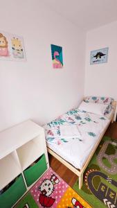 Voodi või voodid majutusasutuse Ciao Bambino! toas