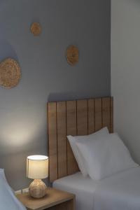 Postel nebo postele na pokoji v ubytování Rondo's Hotel