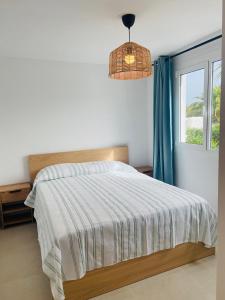 a bedroom with a bed and a window at Eco del Mar in Cala d´Or