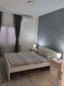 Postel nebo postele na pokoji v ubytování Apartman Lenka