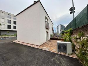 a television sitting on the side of a building at Formai Living apartments in Trento