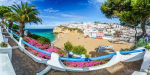 a view of a beach and the ocean at Casa Joao in Carvoeiro