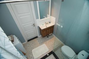 a bathroom with a sink and a toilet at Double room in Next Orange in Batumi +20 photos
