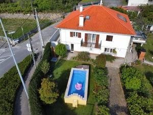 an aerial view of a house with a swimming pool at Casa do Avô Horácio in Viana do Castelo