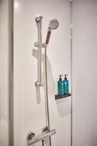a shower stall in a bathroom with a shower at Princess Green 2 - Portrush by the Sea in Portrush