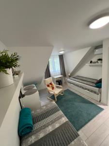 Postel nebo postele na pokoji v ubytování Apartman Nábrežná
