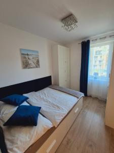 Posteľ alebo postele v izbe v ubytovaní Apartament Turkusowy Kołobrzeg Podczele