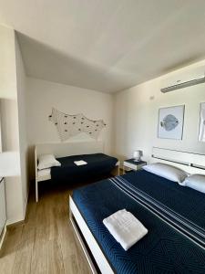 Postel nebo postele na pokoji v ubytování Il paradiso sul mare