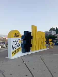 a sign for a hong kong office with the words love hate at Le Fontana in Nice