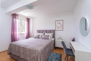 Posteľ alebo postele v izbe v ubytovaní Apartments Pavle