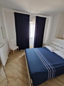 Postel nebo postele na pokoji v ubytování Il paradiso sul mare