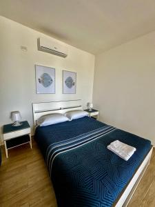 Postel nebo postele na pokoji v ubytování Il paradiso sul mare
