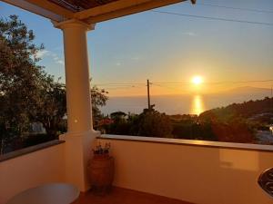 a view of the sunset from the balcony of a house at La Casa di Pitti in Anacapri