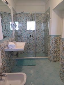 a bathroom with a shower and a sink at La Casa di Pitti in Anacapri