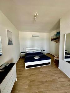 Postel nebo postele na pokoji v ubytování Il paradiso sul mare