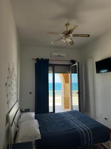 Postel nebo postele na pokoji v ubytování Il paradiso sul mare