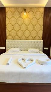 Ένα ή περισσότερα κρεβάτια σε δωμάτιο στο HOTEL RAMSON'S INTERNATIONAL