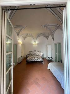 Postel nebo postele na pokoji v ubytování BonConvento Guesthouse - HiTuscany